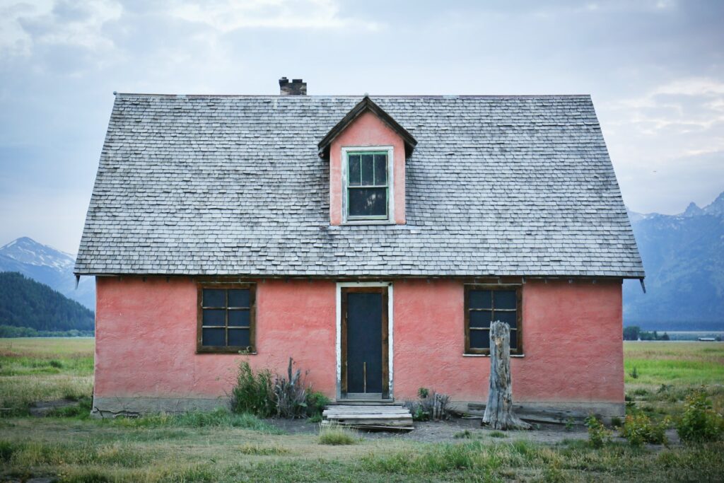 red and gray brick house under gray sky